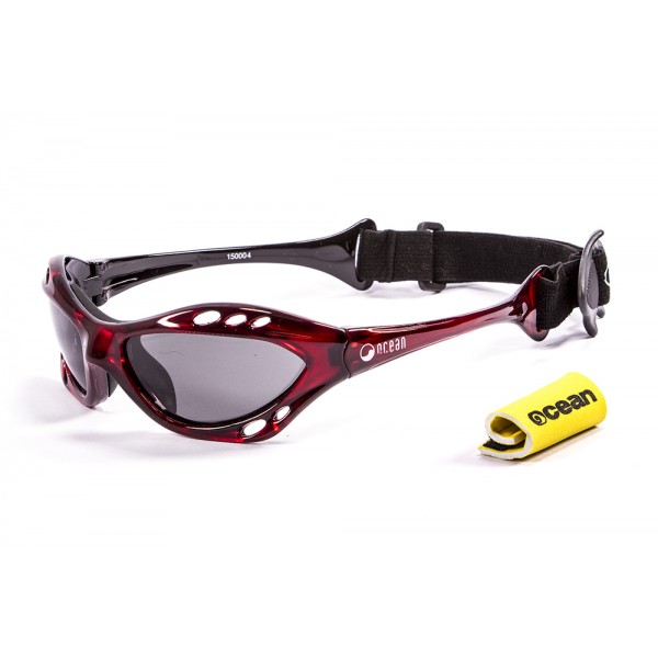 cumbuco kitesurf floating red smoke sunglasses